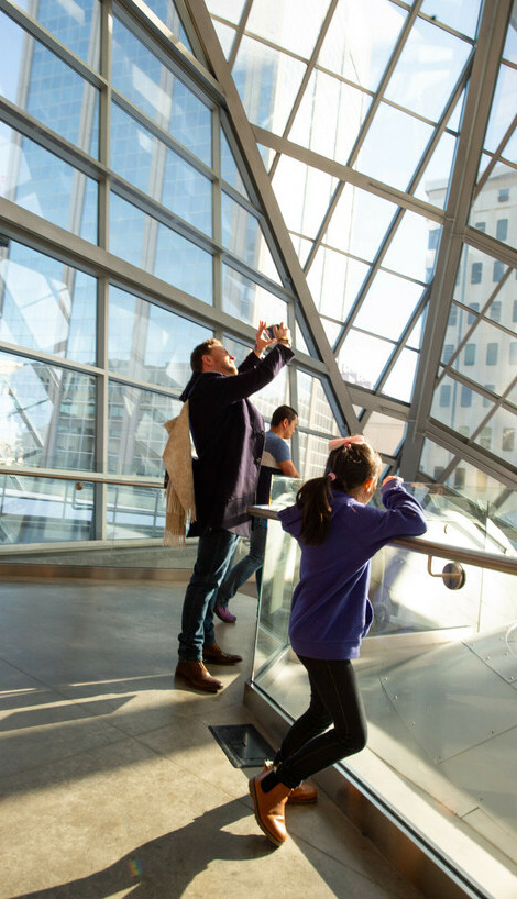 A family gathers inside the Art Gallery for Family Day.