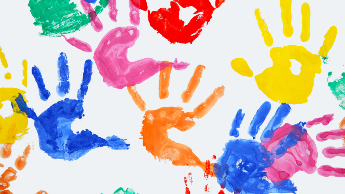 handprints on a paper in multicoloured paint